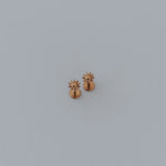 Load image into Gallery viewer, Small gold sun earring on a light gray background
