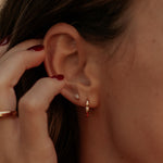Load image into Gallery viewer, Close-up of an ear with earrings and a hand adjusting hair.
