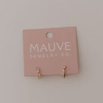 Load image into Gallery viewer, Pink jewelry card with 'MAUVE JEWELRY CO' on a light gray background featuring diamond and gold hoop earrings
