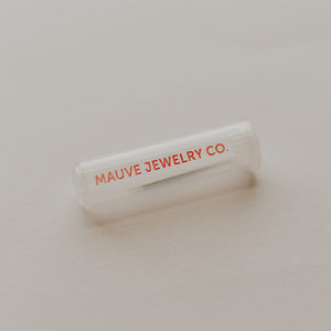 MAUVE JEWELRY CO. branded jewelry box on a neutral background